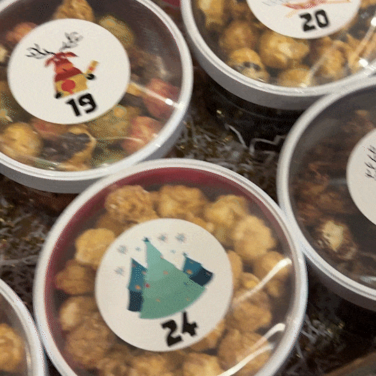 24th day of a festive advent calendar filled with assorted holiday treats.