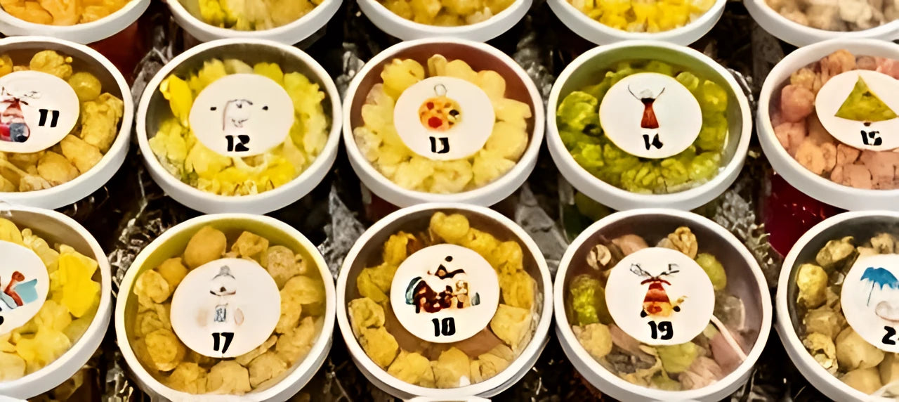 Assorted snacks in small containers with numbered labels on a wooden surface