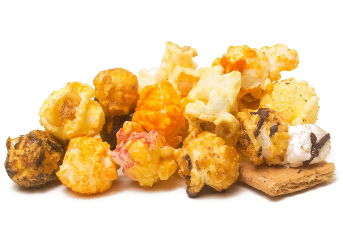 A colorful assortment of gourmet popcorn, including sweet, savory, and s’mores-flavored pieces.