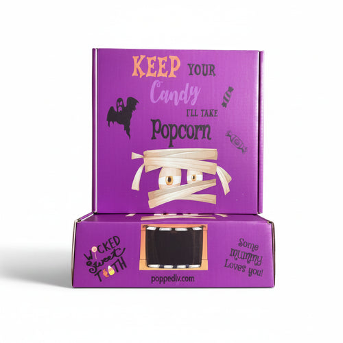 Two stacked purple Halloween-themed boxes with mummy and ghost illustrations.