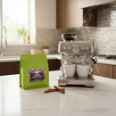 Silver espresso machine with digital display and dual dispensers perfect for sweet cinnamon churro coffee lovers