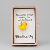 Card with a rubber duck illustration and Mother's Day message in a decorative box.