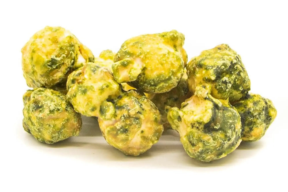 A pile of bright green and yellow wasabi-coated peanuts.
