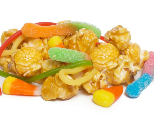 A colorful mix of caramel popcorn, gummy candies, and candy corn.