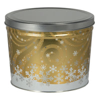 Decorative cylindrical tin with silver lid featuring snowflake patterns on a gold background.