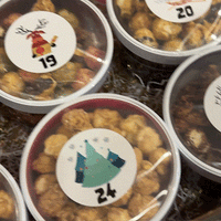 24th day of a festive advent calendar filled with assorted holiday treats.